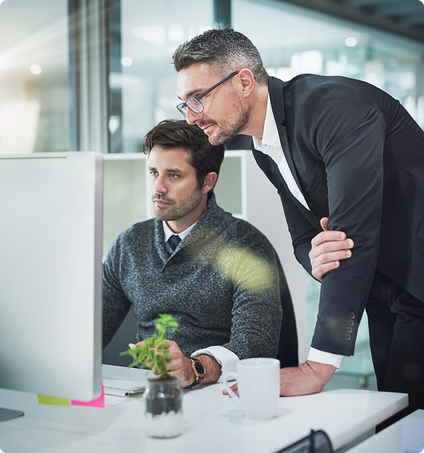 Business team planning product growth on a desktop computer
